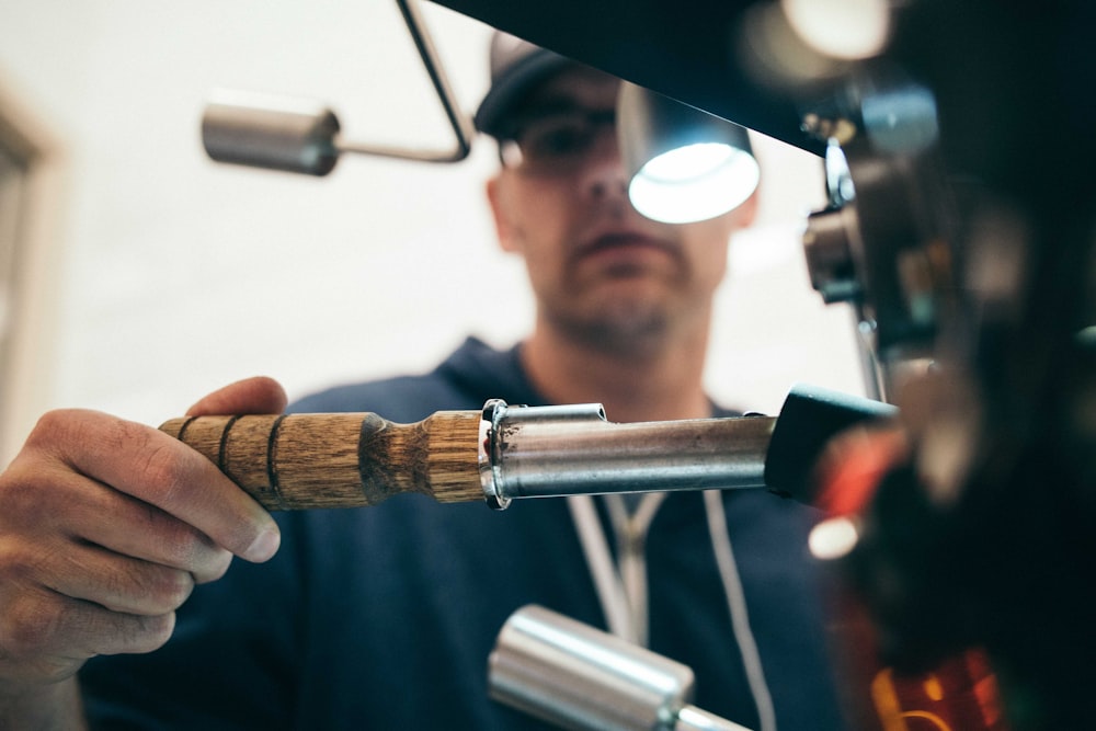 Technician carrying out plant maintenance in a workshop